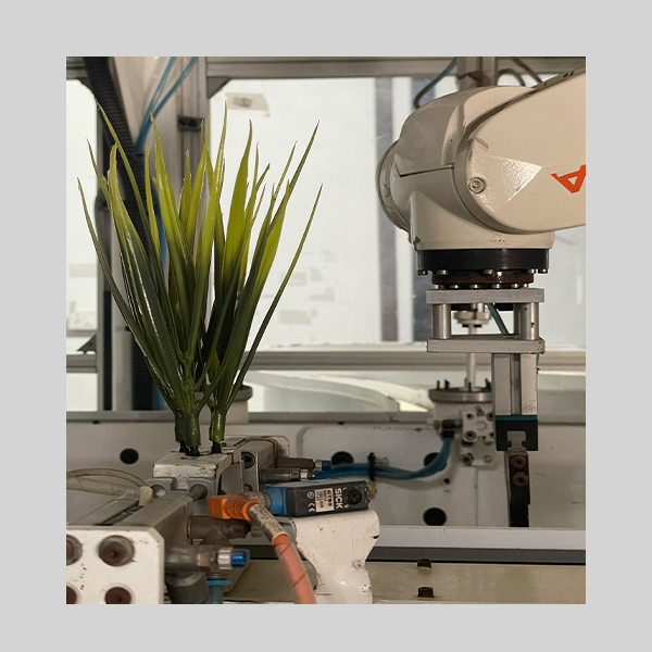 Installed Fully Automated Robotic Assembly Line guided through Vision Camera for Artificial Plants